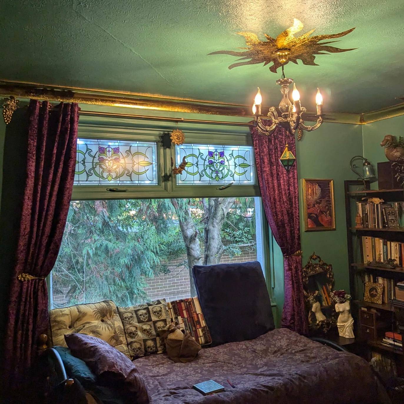 Cynthia flower stained glass window film in a green living room with a traditional aesthetic and vintage decor