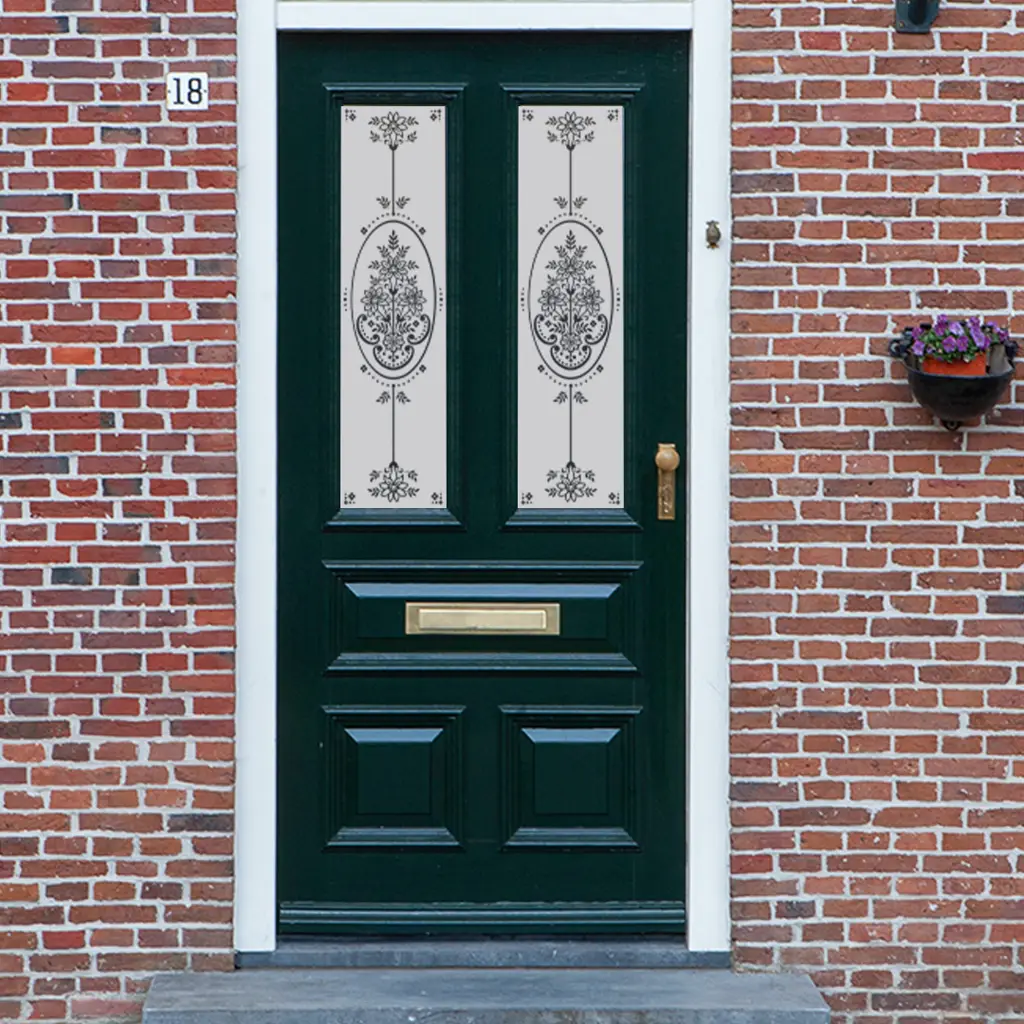 A floral Victorian Frosted Door Window film installed onto an older door with two glass panels