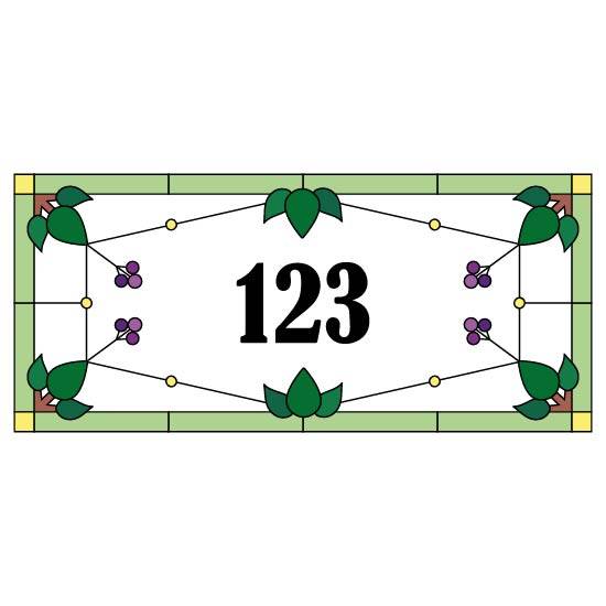 a stained glass design with various leaves pointing towards the middle where a number is placed. at the end of the leaves are purple berries.