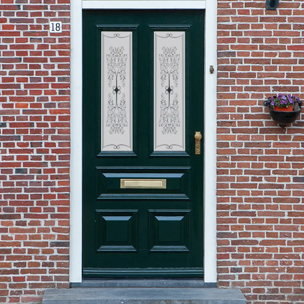 A Victorian frosted door window film with a swirling design and small detailing.